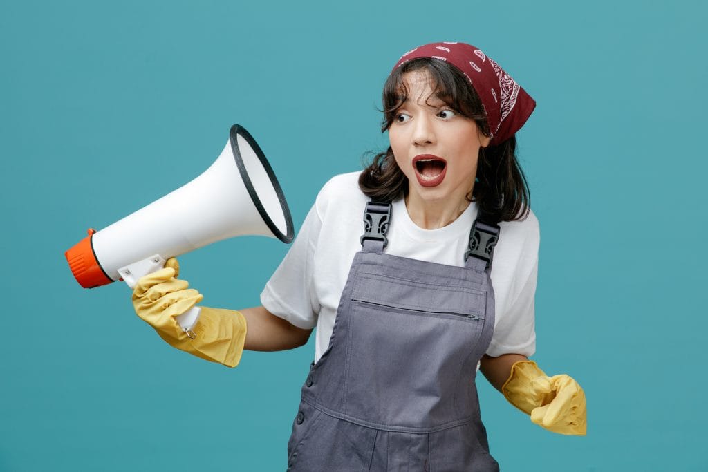 Clendo female cleaner wearing yellow gloves is listeing to the megaphone, hence signifying that we, at Clendo, listen to our customers